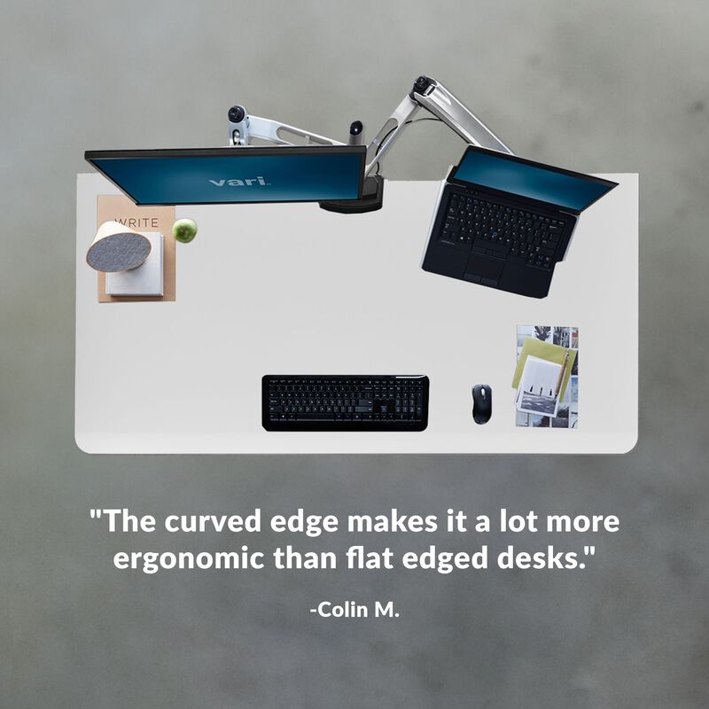 colin m. stated the curved edge makes it a lot more ergonomic than flat edged desks under an overhead image of a desk image number null